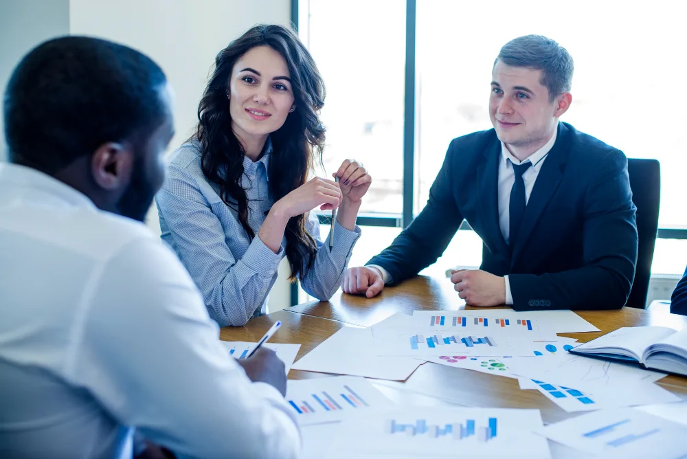 Professionals discussing SAP Human Capital Management strategies in a corporate environment